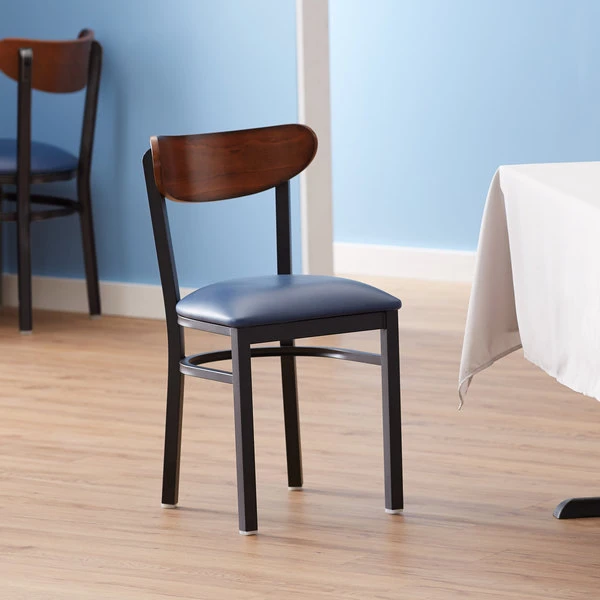 LT&S Boomerang Series Lancaster Table & Seating Boomerang Black Finish Chair With 2 1/2" Navy Vinyl Padded Seat And Antique Walnut Wood Back 3 LT&S Boomerang Series Lancaster Table & Seating Boomerang Black Finish Chair With 2 1/2" Navy Vinyl Padded Seat And Antique Walnut Wood Back