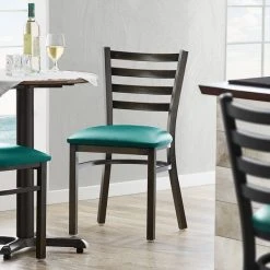 Lancaster Table & Seating Distressed Copper Finish Ladder Back Chair With 2 1/2" Green Vinyl Padded Seat
