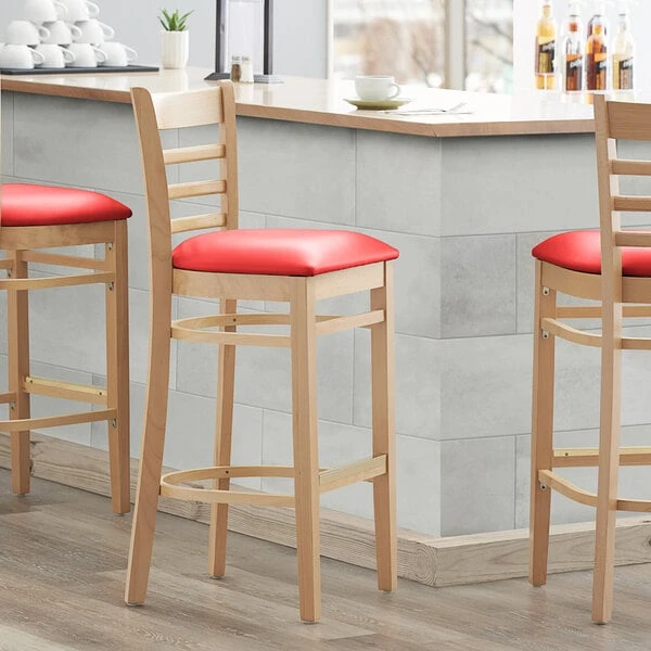Lancaster Table & Seating Natural Ladder Back Bar Height Chair With 2 1/2" Red Padded Seat 3 Lancaster Table & Seating Natural Ladder Back Bar Height Chair With 2 1/2" Red Padded Seat