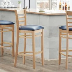 Lancaster Table & Seating Natural Ladder Back Bar Height Chair With 2 1/2" Navy Padded Seat