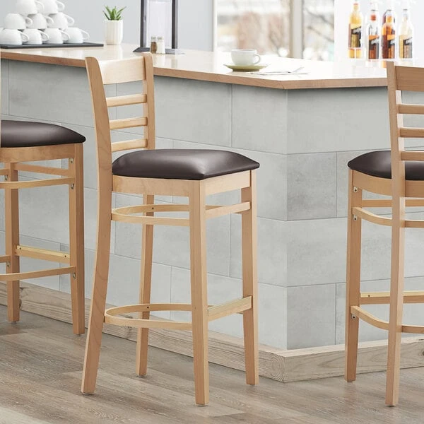 Lancaster Table & Seating Natural Ladder Back Bar Height Chair With 2 1/2" Dark Brown Padded Seat 3 Lancaster Table & Seating Natural Ladder Back Bar Height Chair With 2 1/2" Dark Brown Padded Seat