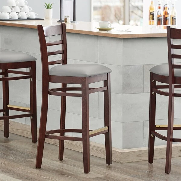 Lancaster Table & Seating Mahogany Finish Wooden Ladder Back Bar Height Chair With Light Gray Padded Seat 3 Lancaster Table & Seating Mahogany Finish Wooden Ladder Back Bar Height Chair With Light Gray Padded Seat