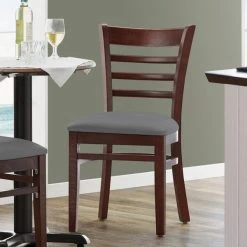 Lancaster Table & Seating Mahogany Finish Wooden Ladder Back Chair With Dark Gray Padded Seat