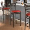 LT&S Spartan Series Lancaster Table & Seating Spartan Series Bar Height Metal Ladder Back Chair With Walnut Wood Grain Finish And Red Vinyl Seat