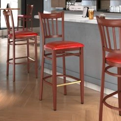LT&S Spartan Series Lancaster Table & Seating Spartan Series Bar Height Metal Slat Back Chair With Mahogany Wood Grain Finish And Red Vinyl Seat