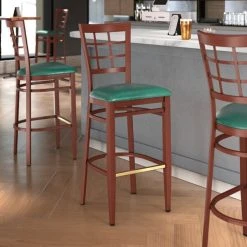 LT&S Spartan Series Lancaster Table & Seating Spartan Series Bar Height Metal Window Back Chair With Mahogany Wood Grain Finish And Green Vinyl Seat