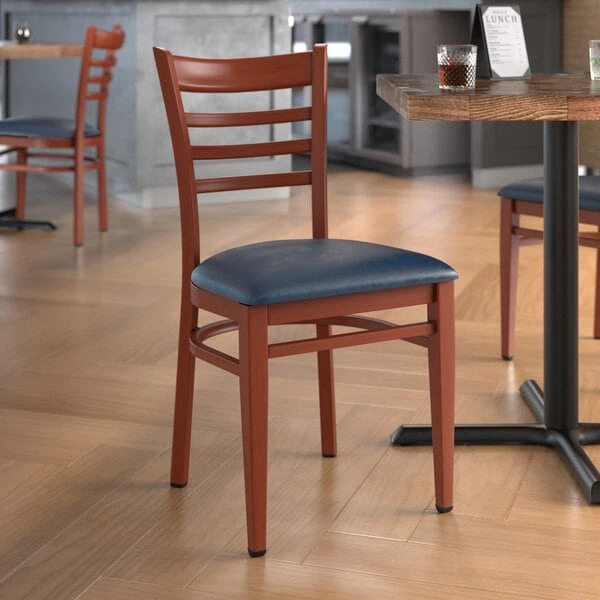 LT&S Spartan Series Lancaster Table & Seating Spartan Series Metal Ladder Back Chair With Mahogany Wood Grain Finish And Navy Vinyl Seat 3 LT&S Spartan Series Lancaster Table & Seating Spartan Series Metal Ladder Back Chair With Mahogany Wood Grain Finish And Navy Vinyl Seat