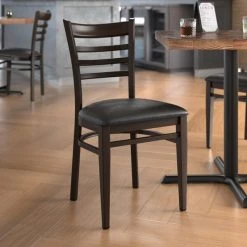 LT&S Spartan Series Lancaster Table & Seating Spartan Series Metal Ladder Back Chair With Walnut Wood Grain Finish And Black Vinyl Seat