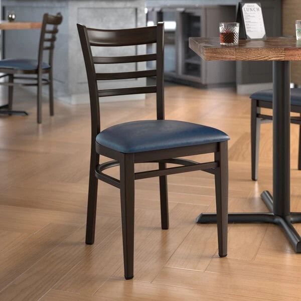 LT&S Spartan Series Lancaster Table & Seating Spartan Series Metal Ladder Back Chair With Walnut Wood Grain Finish And Navy Vinyl Seat 3 LT&S Spartan Series Lancaster Table & Seating Spartan Series Metal Ladder Back Chair With Walnut Wood Grain Finish And Navy Vinyl Seat