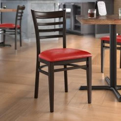 LT&S Spartan Series Lancaster Table & Seating Spartan Series Metal Ladder Back Chair With Walnut Wood Grain Finish And Red Vinyl Seat