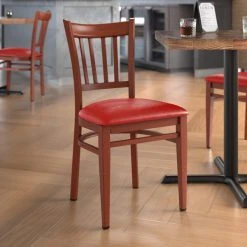 LT&S Spartan Series Lancaster Table & Seating Spartan Series Metal Slat Back Chair With Mahogany Wood Grain Finish And Red Vinyl Seat