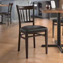 LT&S Spartan Series Lancaster Table & Seating Spartan Series Metal Slat Back Chair With Walnut Wood Grain Finish And Black Vinyl Seat